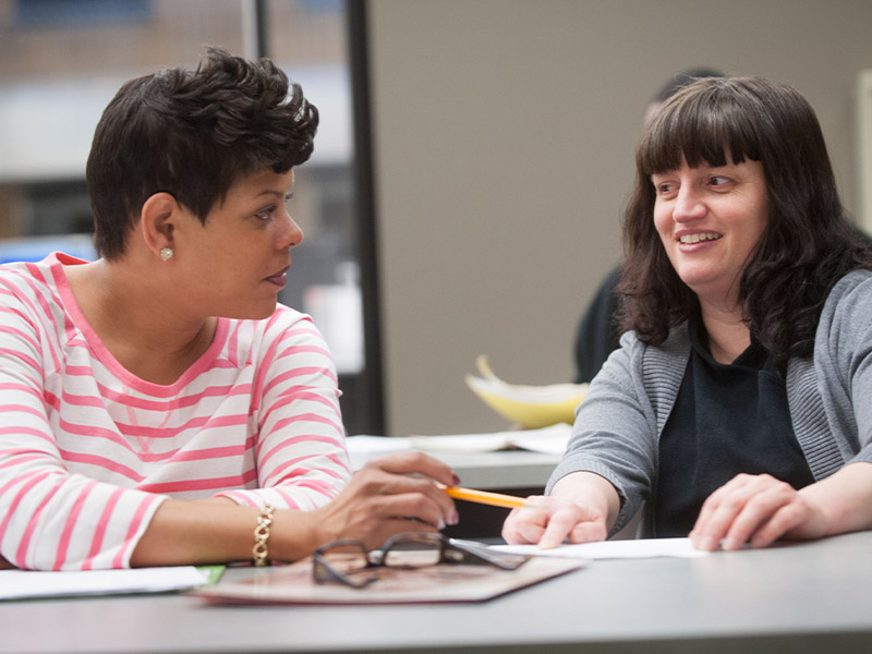 one woman being tutored by another