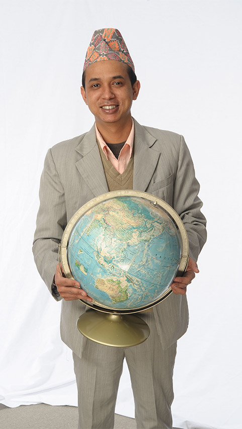 ESOL student holding a globe