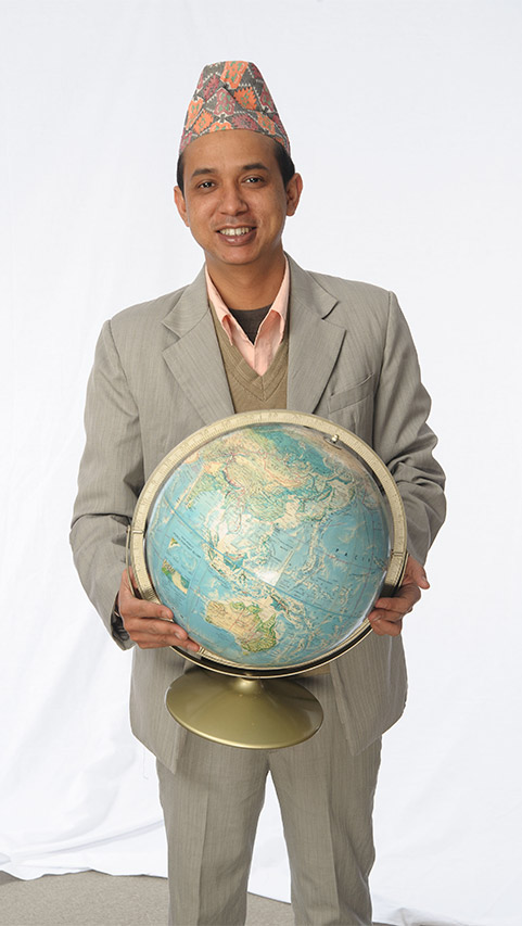 ESOL student holding a globe