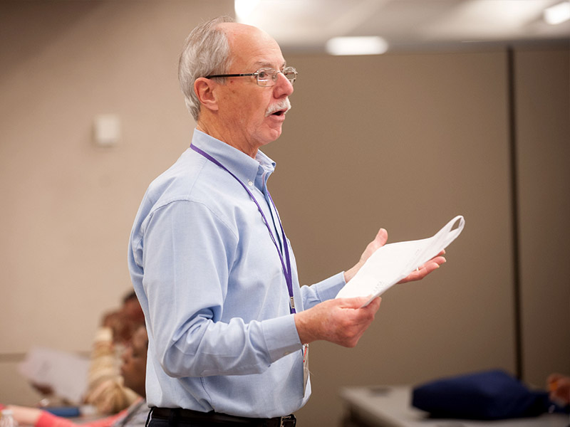 male teacher in front of class